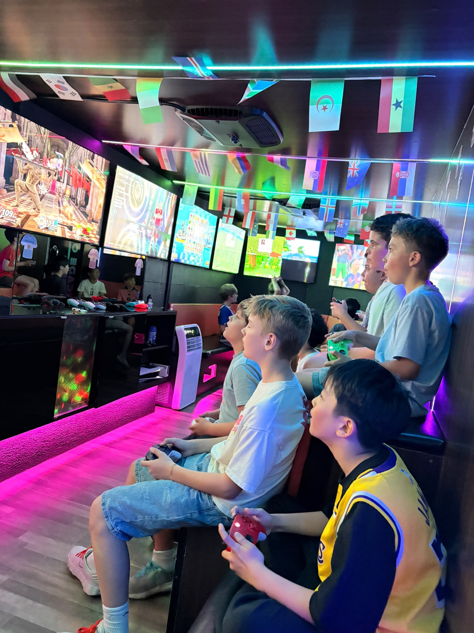 Kids enjoying multiplayer games inside the trailer